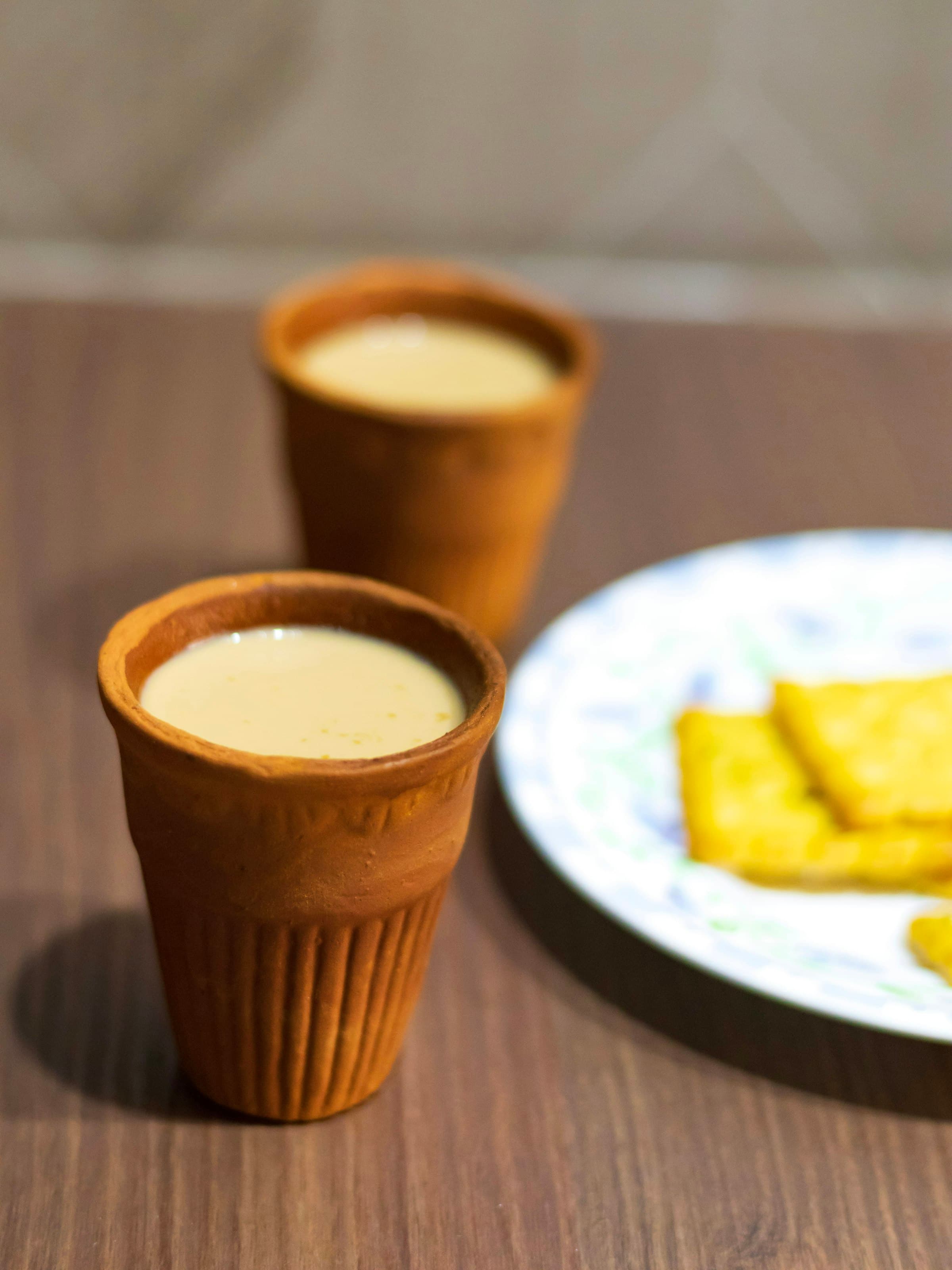 Chai in clay kulhads with biscuits